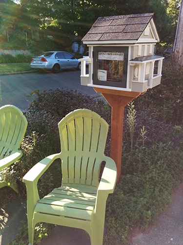 Little Free Library with green chairs