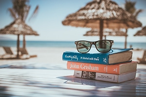 Stack of books by the beach