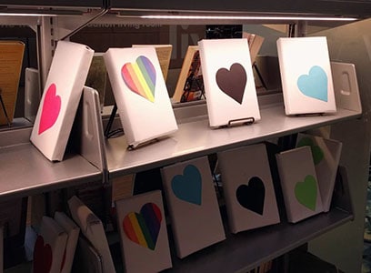 wrapped books on a library shelf